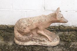 A reconstituted stone statue of a fox,