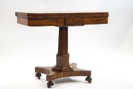 A William IV rosewood card table on a six sided column and quatre form base, 75cm high x 91.