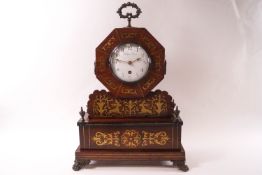 A Regency mahogany and brass inlaid mantel clock,