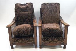 A 1920's three piece mahogany and oak Bergere suite : two seater sofa,