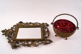 An ornate red glass and pierced gilt metal bon bon dish,