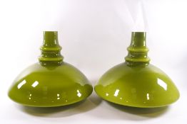 A pair of 1970's green glass ceiling shades,