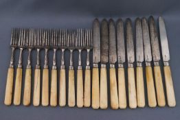 A set of George III silver and ivory handled tea knives and forks,
