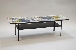 A 1960's coffee table, the formica top printed in John Piper 'London Skyline' pattern,
