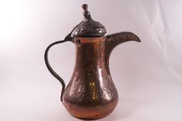 A large Middle Eastern copper Dallah,