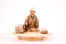 An early 20th century Japanese ivory netsuke, carved as a seated man on an oval base, unsigned,