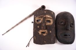 Two carved hardwood ethnographic masks, one rectangular, 28cm high x 19cm wide,