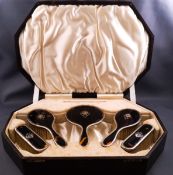 A tortoiseshell and silver mounted five piece dressing table set,