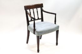 A 19th century cross-banded mahogany bar back open arm elbow chair, having a reeded spindle back,