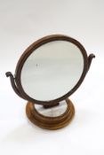 A Victorian circular mahogany and marble base dressing table mirror,