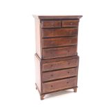 A doll's house cross-banded mahogany chest on chest,