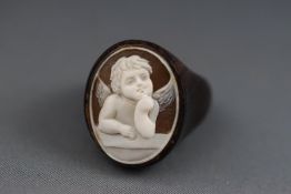 An unusual wooden carved cameo ring. Size M. 8.