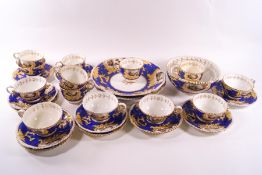 A 19th century Rockingham porcelain tea and coffee service comprising: seven teacups,