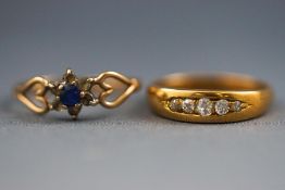 A selection of two dress rings consisting of a yellow gold half hoop diamond ring,
