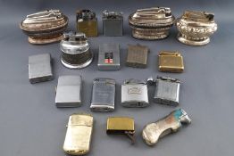 A collection of lighters, including three silver plated Ronson table lighters,