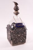 A Continental glass and pierced silver mounted decanter, stamped 800, 25cm high,