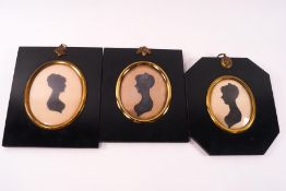 Three 19th century silhouettes of ladies,