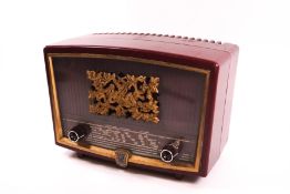 An AIWA Radiola red bakelite radio, 17.