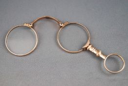 A pair of rose gold lorgnettes 19.