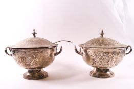 A pair of EPNS two handled sauce tureens and covers, heavily engraved with Rococo style decoration,