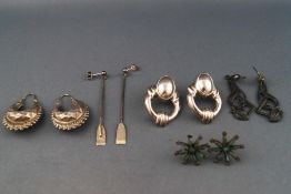 A selection of five pairs of silver earrings to include studs, drops and creoles. Gross weight: 34.
