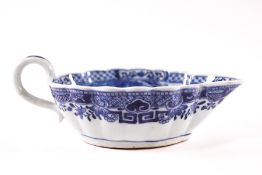 A Chinese blue and white porcelain sauce boat with scalloped shape edge,