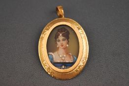 An Italian miniature portrait pendant pendant/brooch having a pendant bale and pin/hook fittings.