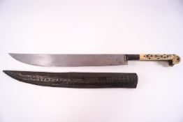 A Middle Eastern dagger with metal inlaid bone handle and a metal covered sheath,