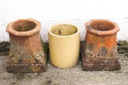 A pair of 'Canon' chimney pots, 38cm high x 32cm wide,