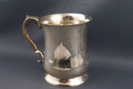 A silver pint mug with a baluster body and double scroll handle, Sheffield 1950, by Emile Viner,