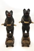 A 19th century matched pair of Black Forest bear stick stands, carved and painted,