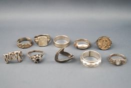 A selection of ten silver rings consisting of signet, coin set and some gem set.