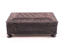 An Indian carved hardwood spice box with compartmental interior, 4cm high x 12.