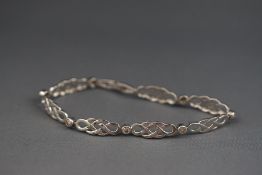 A 14ct white gold Celtic lattice style diamond bracelet 0.75ct approximately Stamped 14K 9.