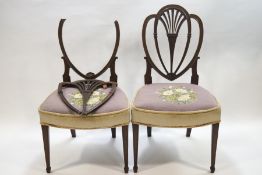 A pair of George III mahogany side chairs, heart shape backs with pierced fan splats,