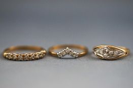 A selection of three 9ct gold diamond rings consisting of a half hoop band,
