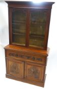 A Victorian mahogany secretaire bookcase, the glazed upper half with two adjustable shelves,