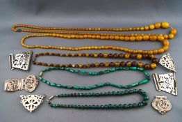 A selection of five beaded necklaces to include malachite and copal resin together with three