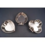 Three silver pin dishes, in the form of playing card suites, club, heart and spade,