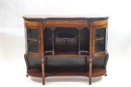 A Victorian rosewood credenza with bow fronted side cabinets,