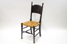 An Arts & Crafts oak chair in the manner of William Birch,
