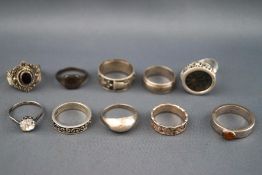 A selection of ten silver rings ranging from plain band to semi precious gem set.