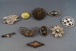 A selection of Ten silver brooches of mostly filigree design. Gross weight; 64.