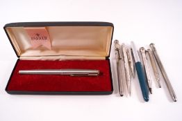 Two Parker fountain pens, silver propelling pencils and others,