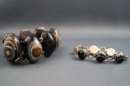 An elasticated large banded agate bracelet together with a Victorian sterling silver cabochon agate