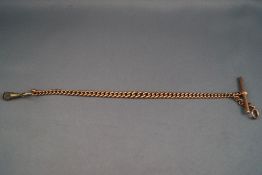 A rose gold graduated albert chain with T-bar, bolt ring and gold plated swivel attachment.