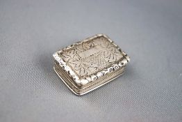A George IV silver vinaigrette, engraved with leaves,