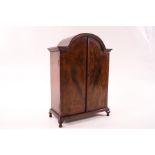 A doll's house mahogany double wardrobe, the interior with removable shelf and hanging hooks,