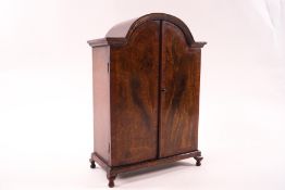 A doll's house mahogany double wardrobe, the interior with removable shelf and hanging hooks,