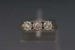 A 9ct yellow gold multi cluster diamond ring stated as 0.33ct total. Stamped 375. Size: L 1/2. 2.